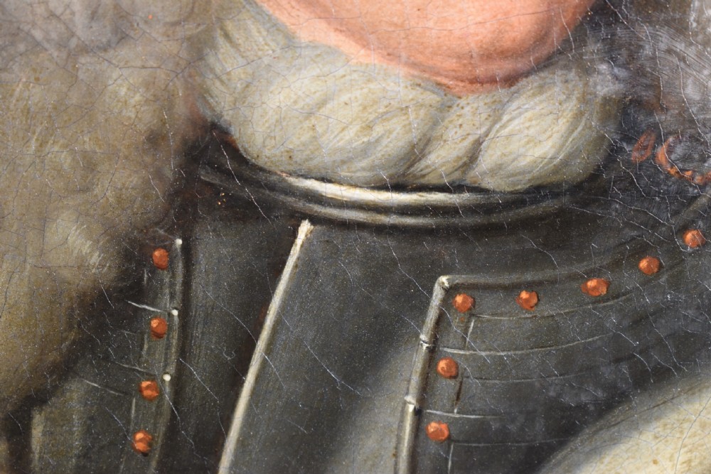 An 18th-century Baroque oil painting depicting a gentleman wearing full plate armour and a powdered wig, set within a heavily moulded giltwood frame. View IX