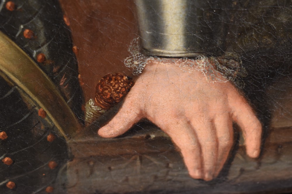 An 18th-century Baroque oil painting depicting a gentleman wearing full plate armour and a powdered wig, set within a heavily moulded giltwood frame. View X