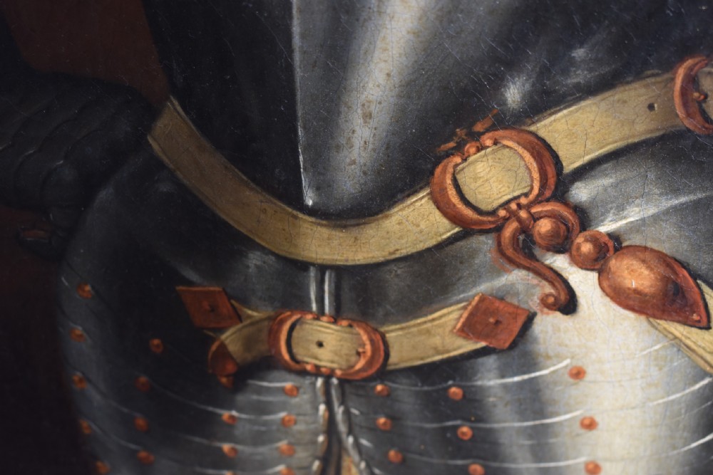An 18th-century Baroque oil painting depicting a gentleman wearing full plate armour and a powdered wig, set within a heavily moulded giltwood frame. View XII