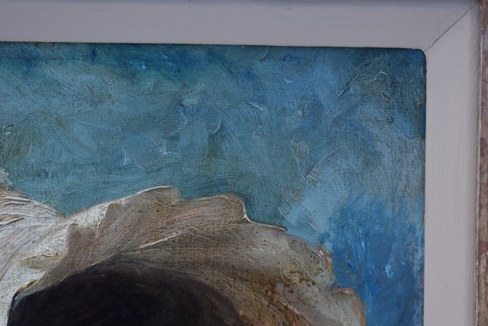 An antique oil painting depicting a woman wearing a white bonnet, framed in an ornate gilded frame with a teal slip. View V