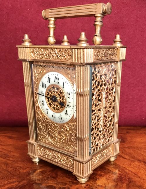 Carriage Clock with Filigree Mask and Side Panels Circa 1900