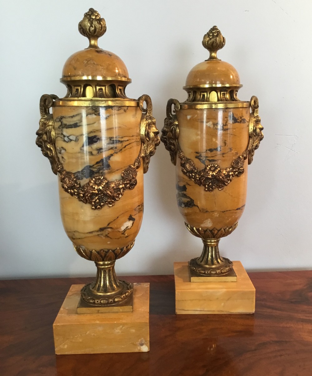 A PAIR OF 19th CENTURY SIENNA MARBLE URNS - SOLD