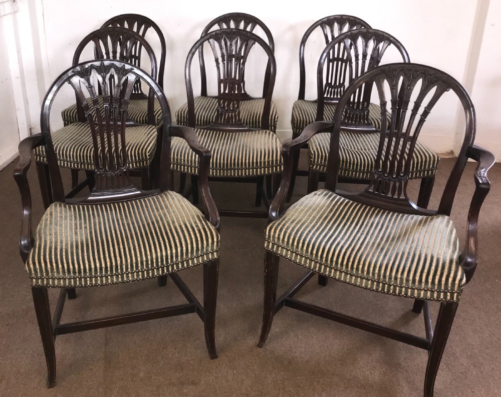  A set of eight George the III mahogany dining chairs 