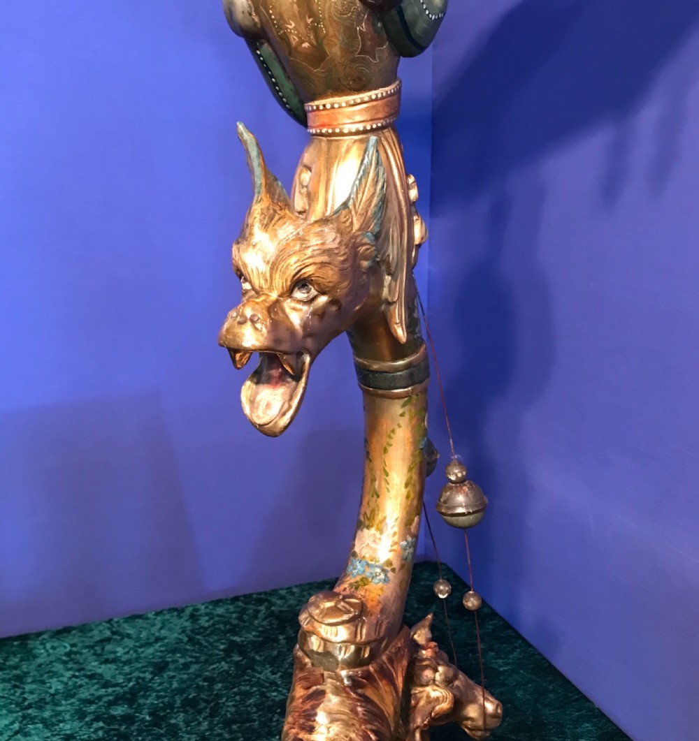 A carved and gilded Venetian torchere pedestal stand featuring a central sculpted figure, floral motifs, and an ornate base. View VI