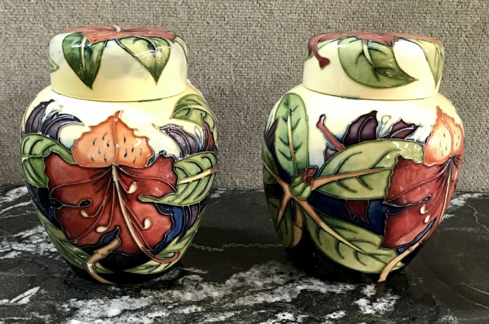 A pair of Moorcroft vases and covers
