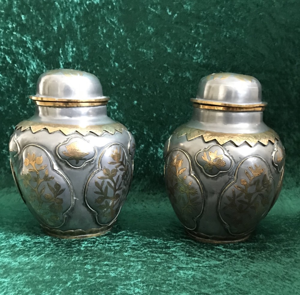 A pair of unusual metal inlaid Oriental vases circa 1880