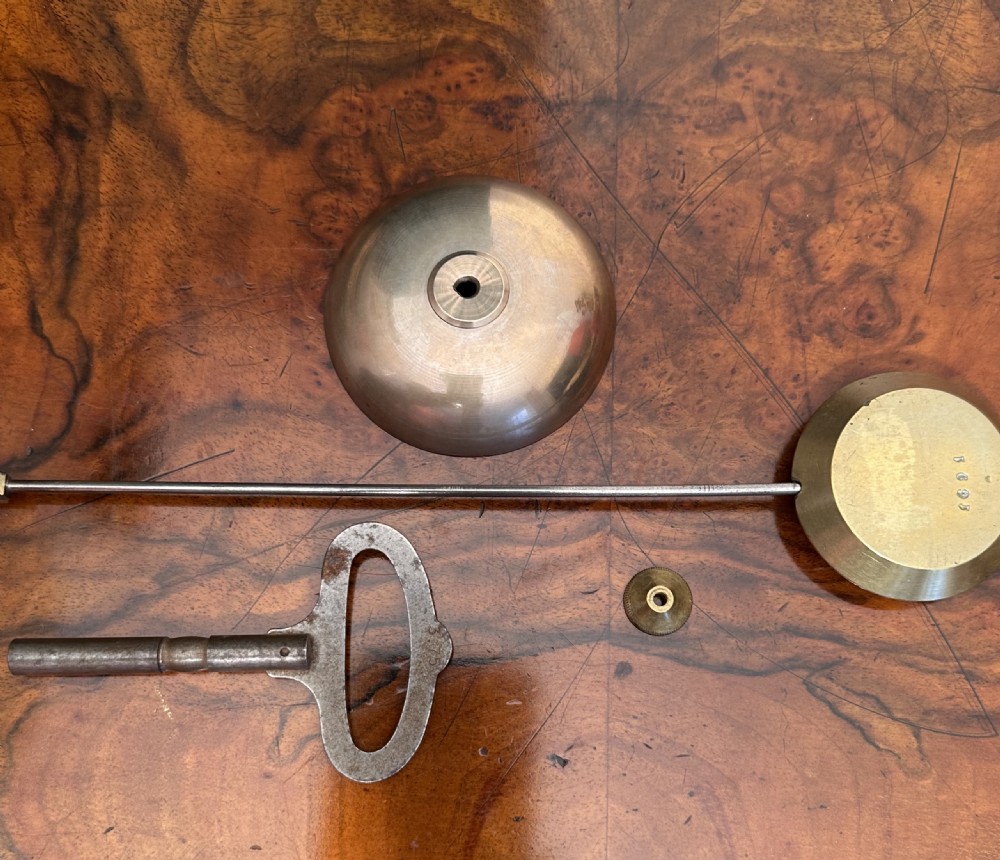 A 19th-century French mantel clock featuring a grey painted metal case decorated with gilded mounts and hand-painted porcelain panels topped with an urn finial. View V