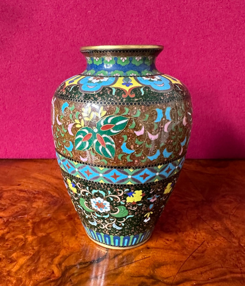 A Japanese Meiji period cloisonne enamel vase decorated with bird and floral motifs against a goldstone speckled ground. View IV