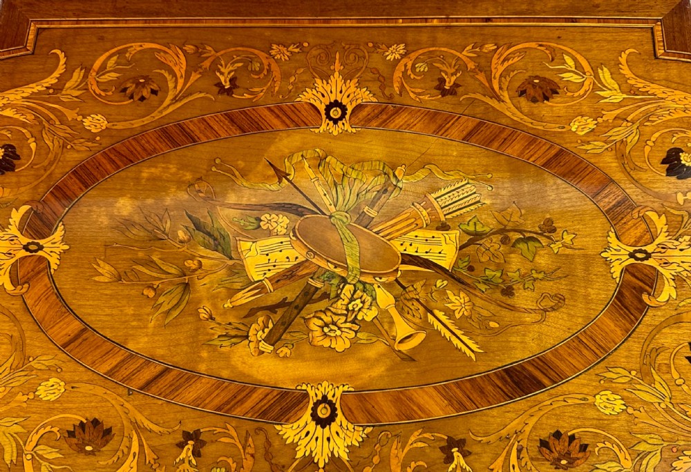 A late 19th-century French Louis XVI style marquetry poudreuse table featuring floral marquetry inlay, Greek key frieze, ormolu mounts, and fluted tapered legs. View VII