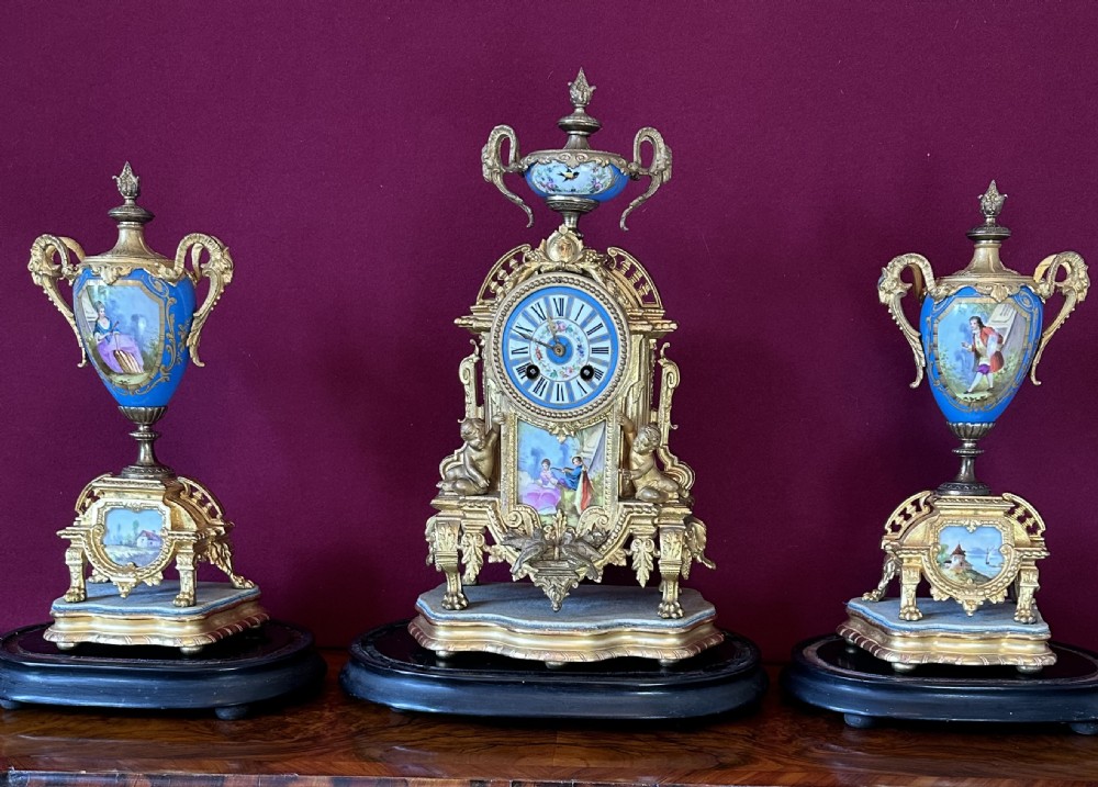 Clock Garniture with 3 glass domes Circa 1875