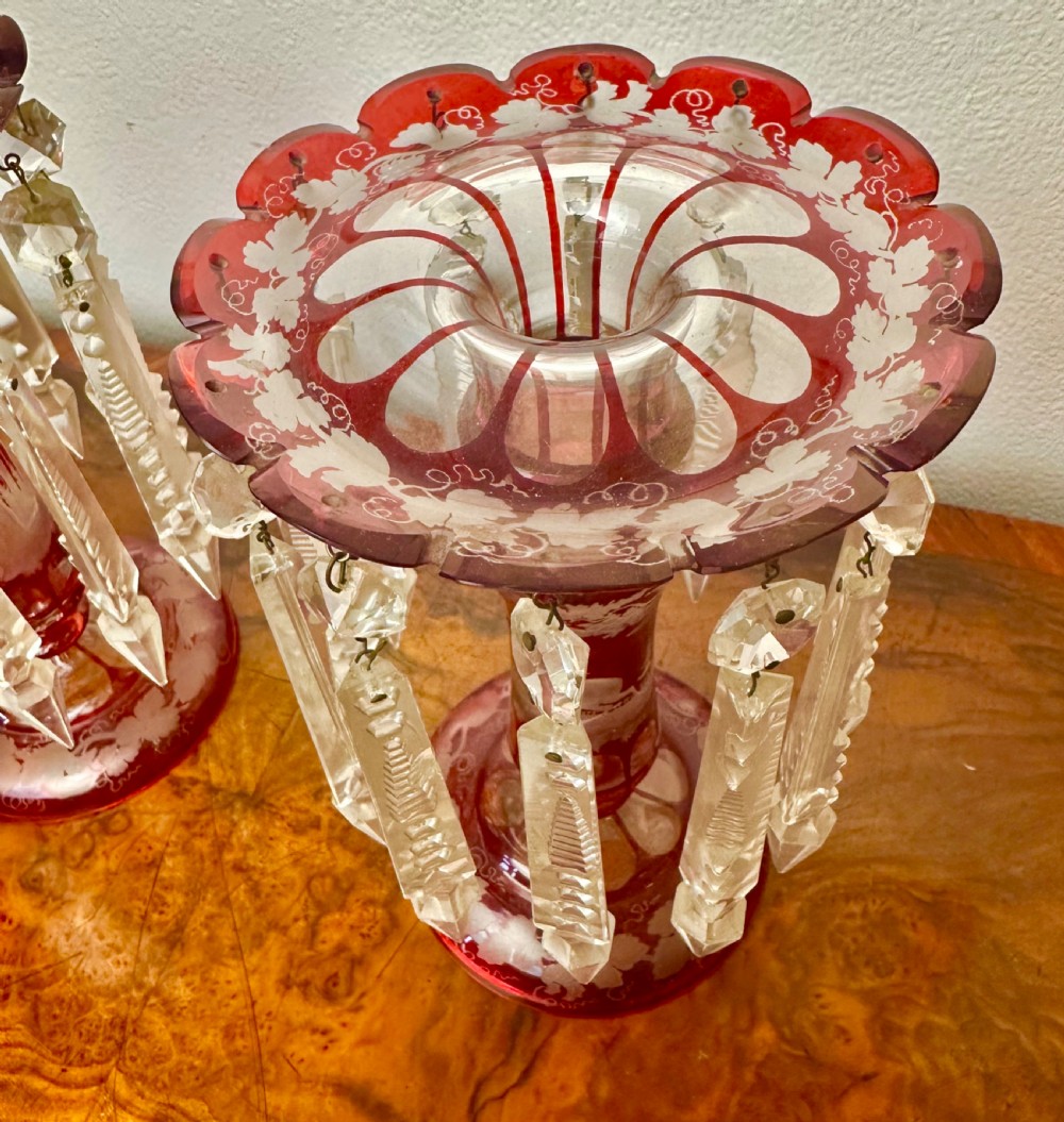 A pair of 19th-century Victorian ruby red flash glass lustres with acid-etched stag scenes, scalloped rims, and suspended clear crystal prism drops. View III