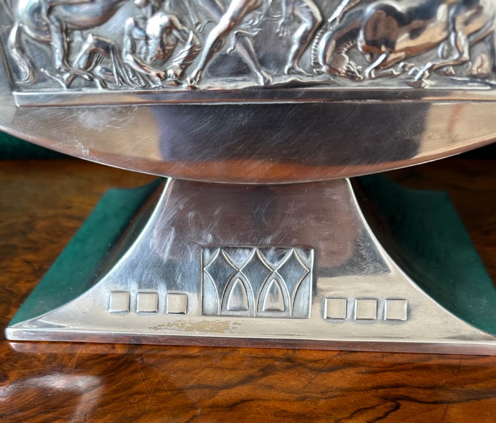 An Art Deco silver-plated boat-shaped tazza with a central classical relief panel and a fitted cut glass liner. View IV