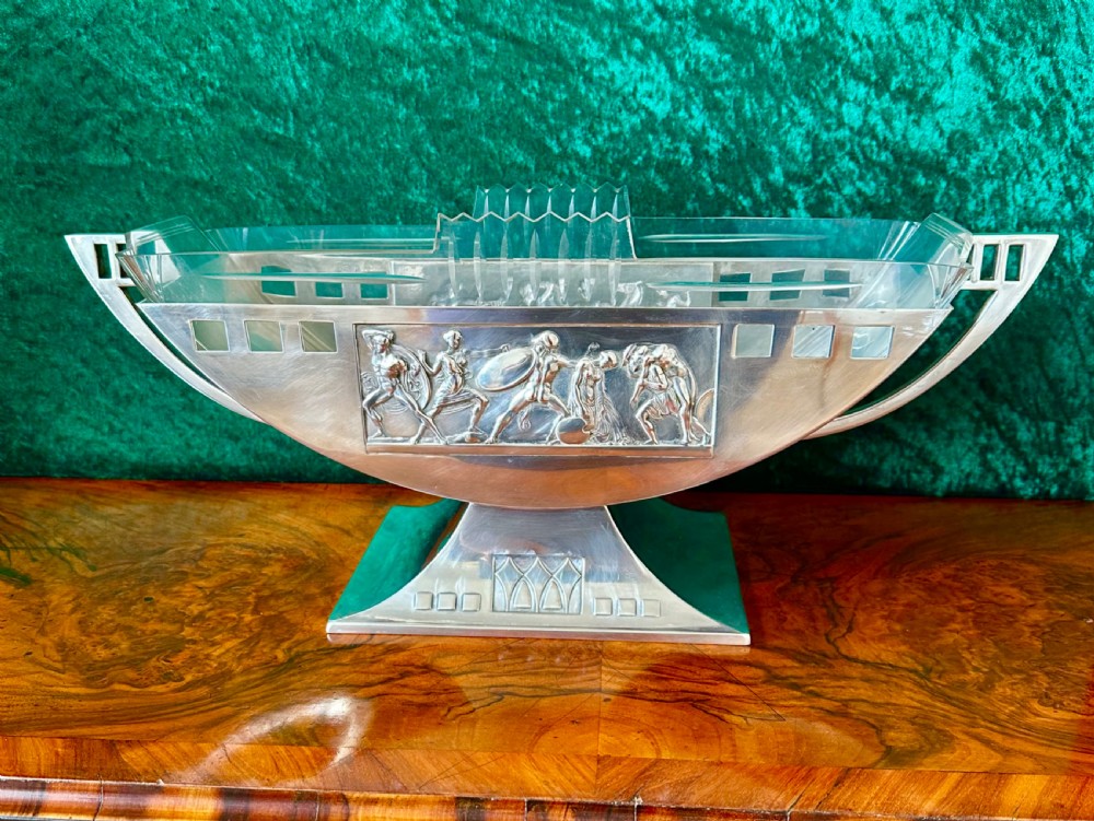 An Art Deco silver-plated boat-shaped tazza with a central classical relief panel and a fitted cut glass liner. View XII