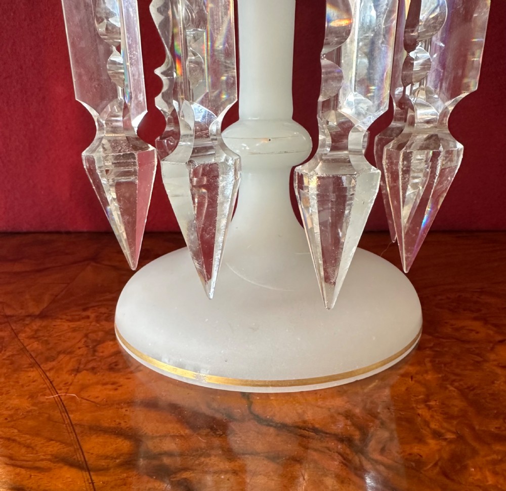 A pair of Victorian frosted white glass lustres featuring crenellated gilt-rimmed tops and suspended clear cut-crystal spearhead prisms. View III