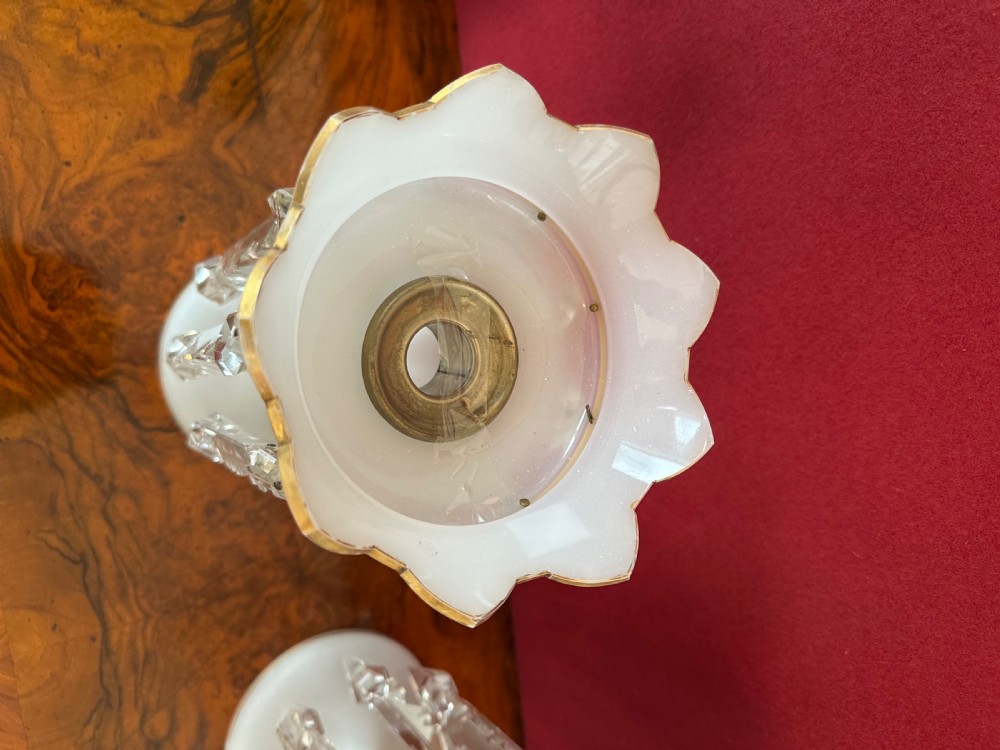 A pair of Victorian frosted white glass lustres featuring crenellated gilt-rimmed tops and suspended clear cut-crystal spearhead prisms. View VII
