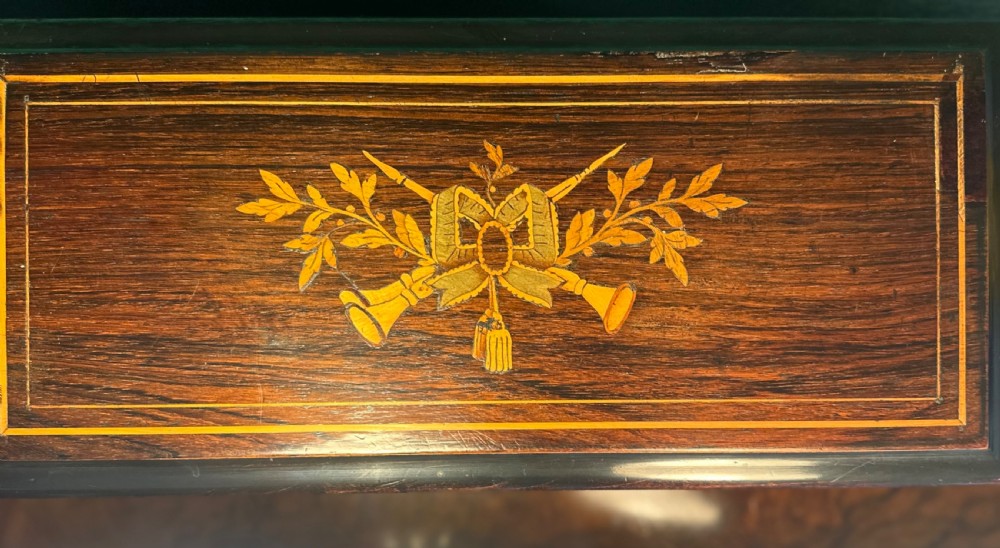 A Victorian ebonised wood music box shown with its hinged lid open, revealing a printed tune card and an internal glass cover over a brass cylinder and steel comb mechanism. View IV