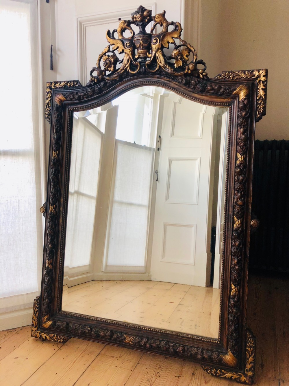 Antique French gilt and wood crested mirror - bevelled glass