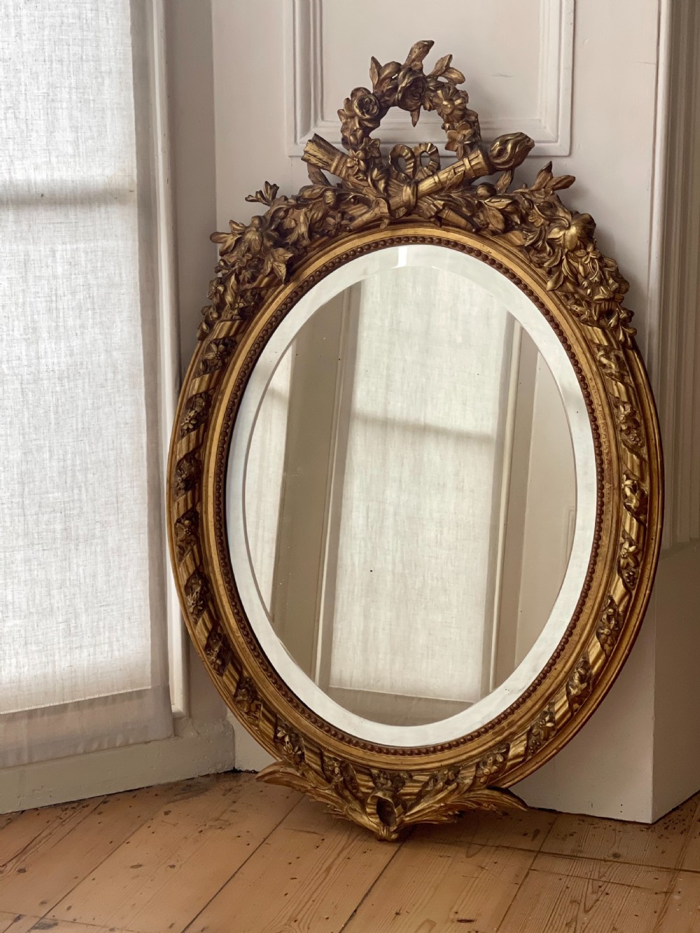Antique French gilt oval mirror