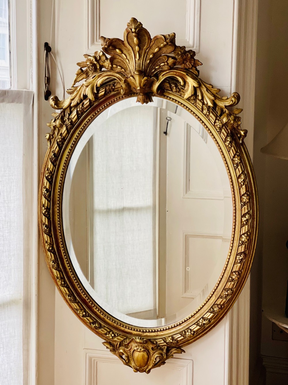Antique French gilt oval mirror