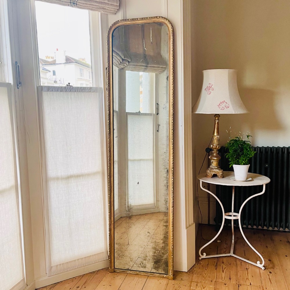 Antique French gilt leaner mirror