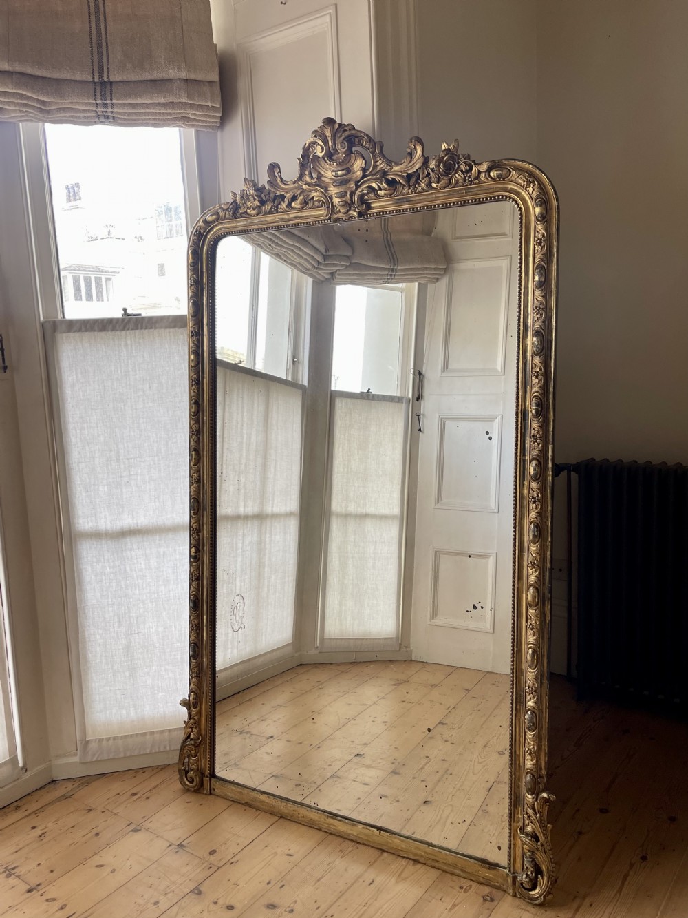 Antique French gilt leaner mirror overmantel