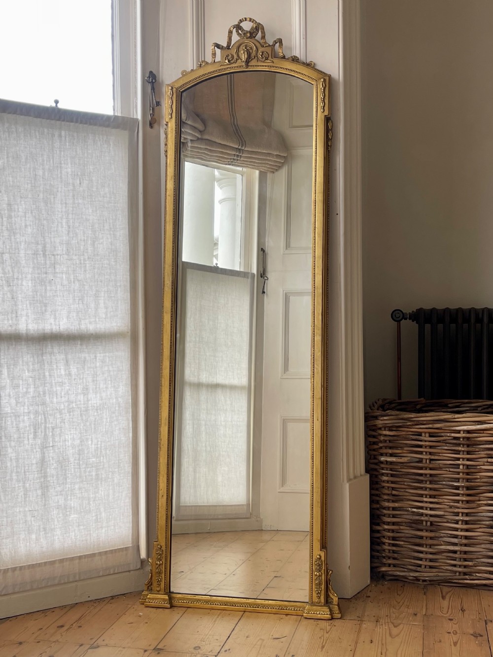 Tall 19th century French gilt mirror