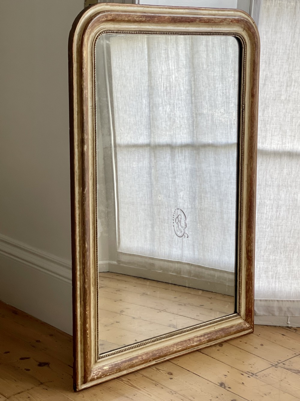 Large antique French gilt and bare gesso mirror