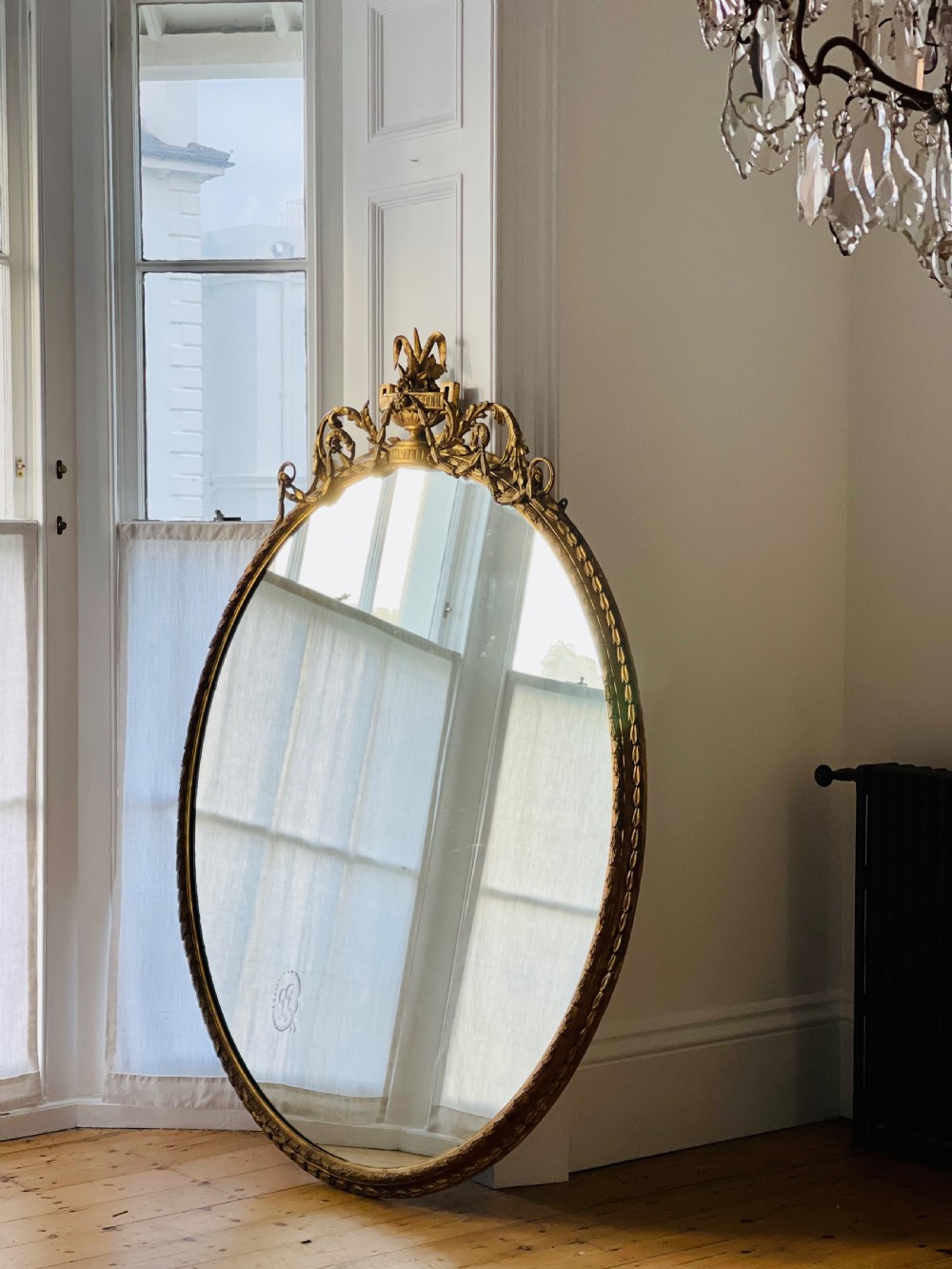 Large antique English  gilt oval mirror 