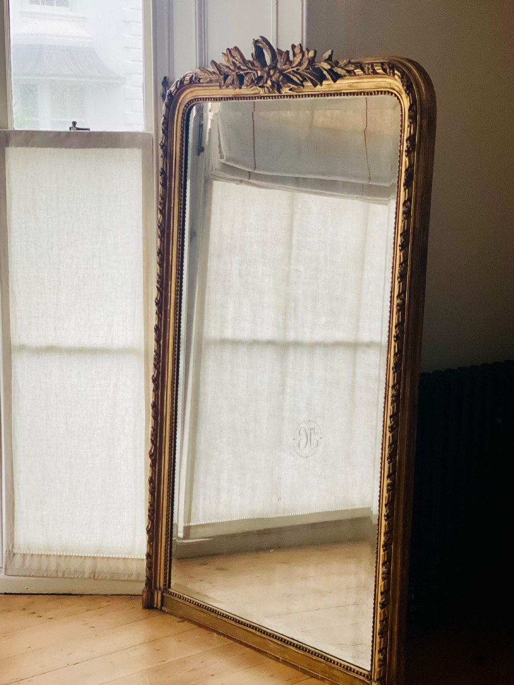 Large antique French gilt leaner mirror - bevelled mercury glass