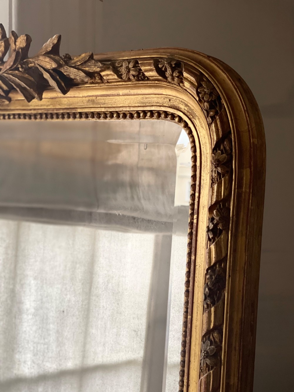 Large antique French gilt leaner mirror - bevelled mercury glass View V