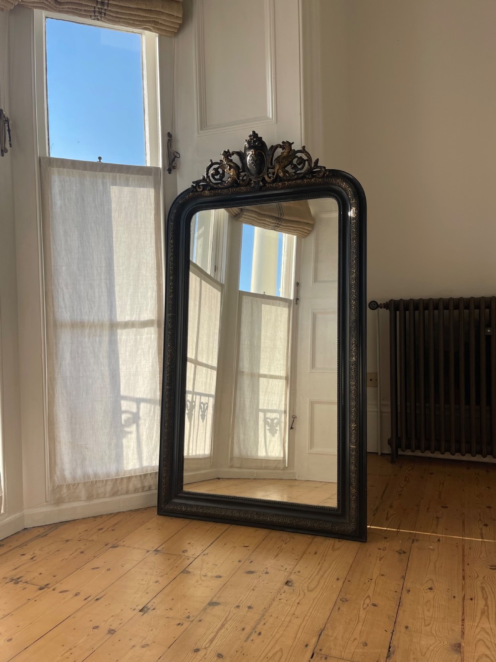 Large antique French and gilt ebonised mirror 