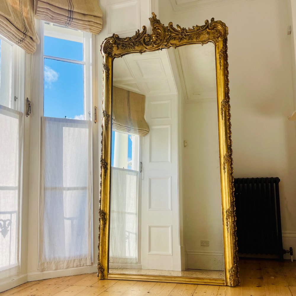 Large French gilt leaner mirror 