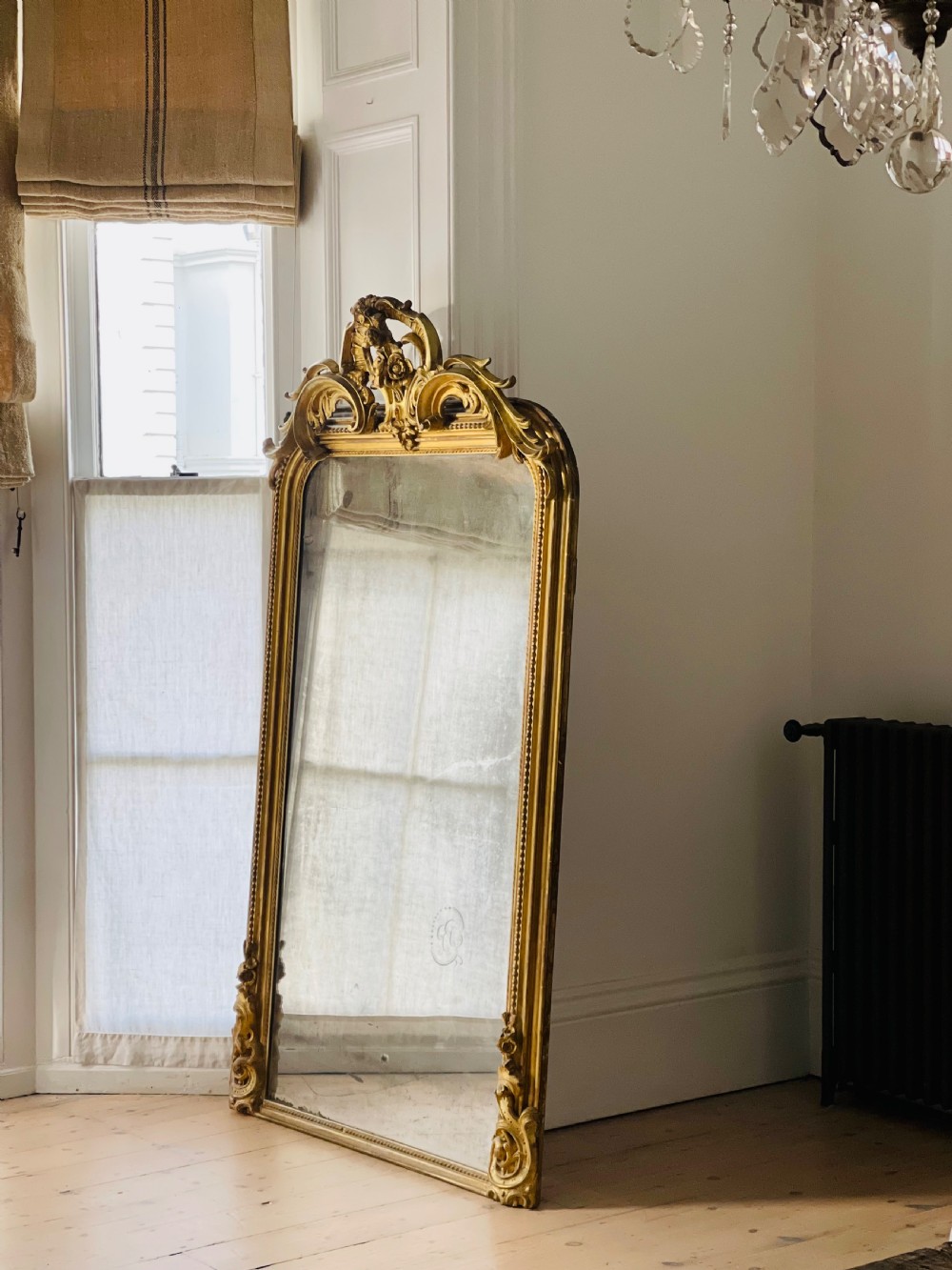 Large antique French gilt leaner mirror 