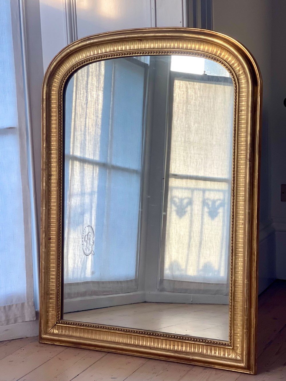 Antique French gilt arched mirror c1880