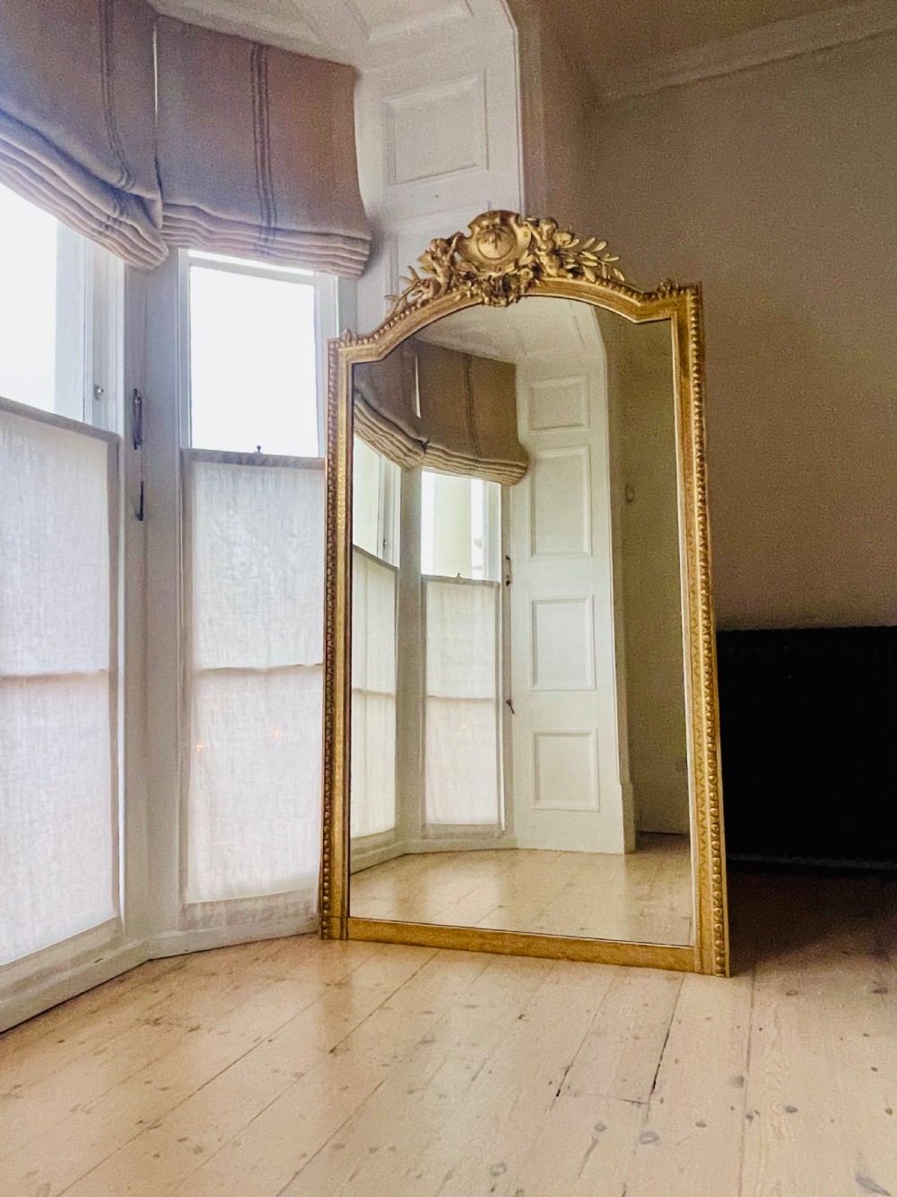 Large antique French gilt leaner mirror 