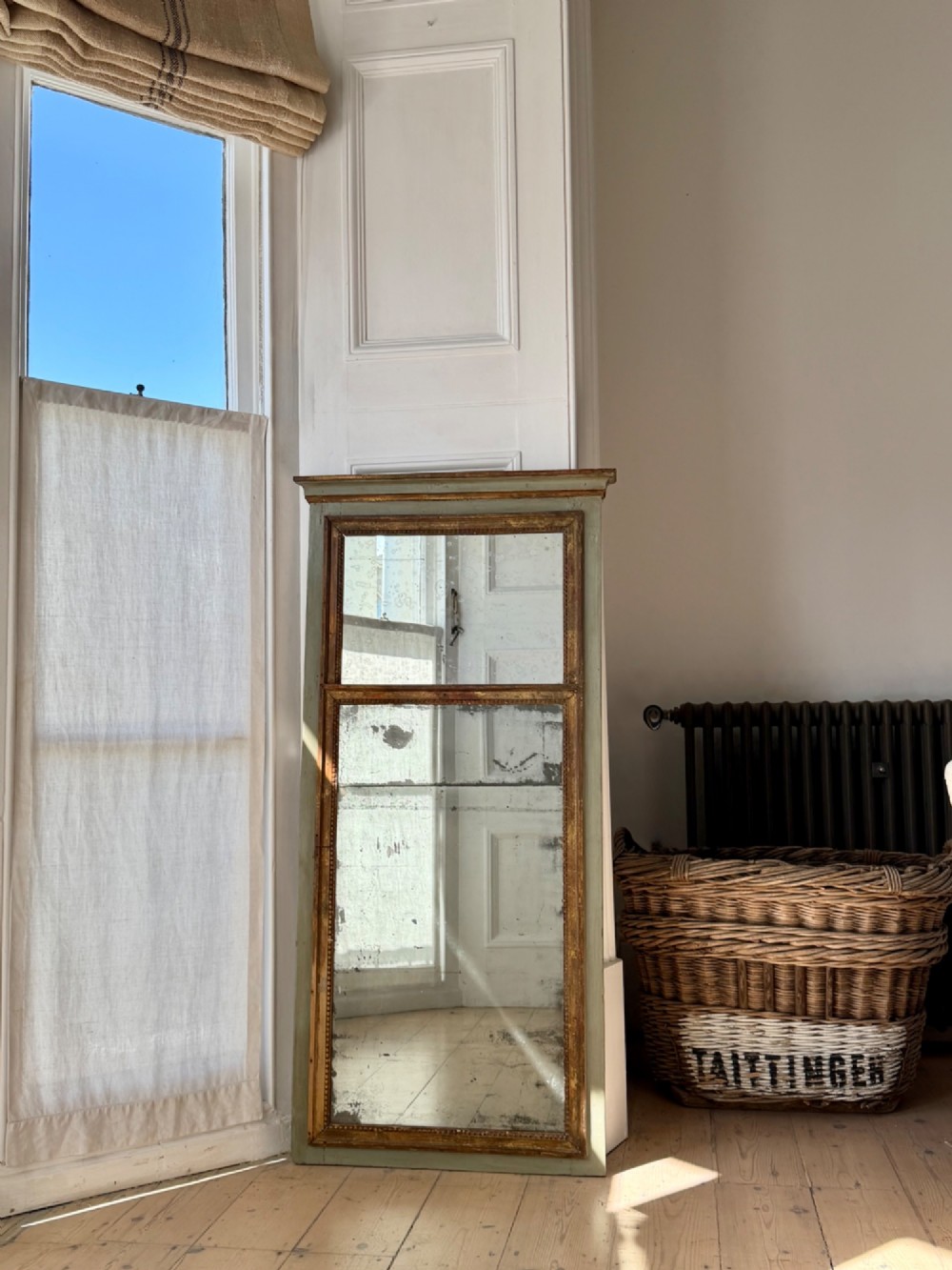 A tall rectangular French trumeau mirror featuring a sage green painted outer timber frame, a beaded gilt inner border, and two distressed mercury glass plates. View II
