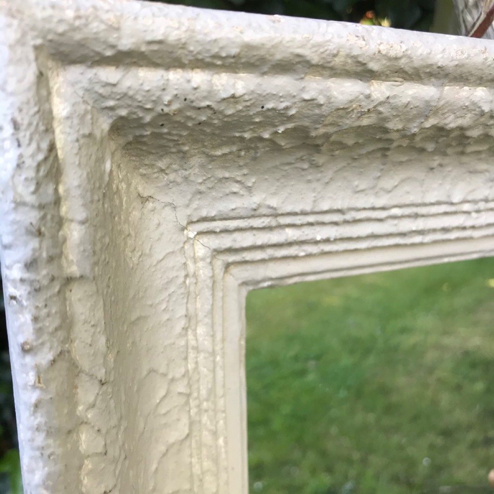 A rectangular off-white painted French framed wall mirror featuring a moulded timber border and reflective glass plate. View III