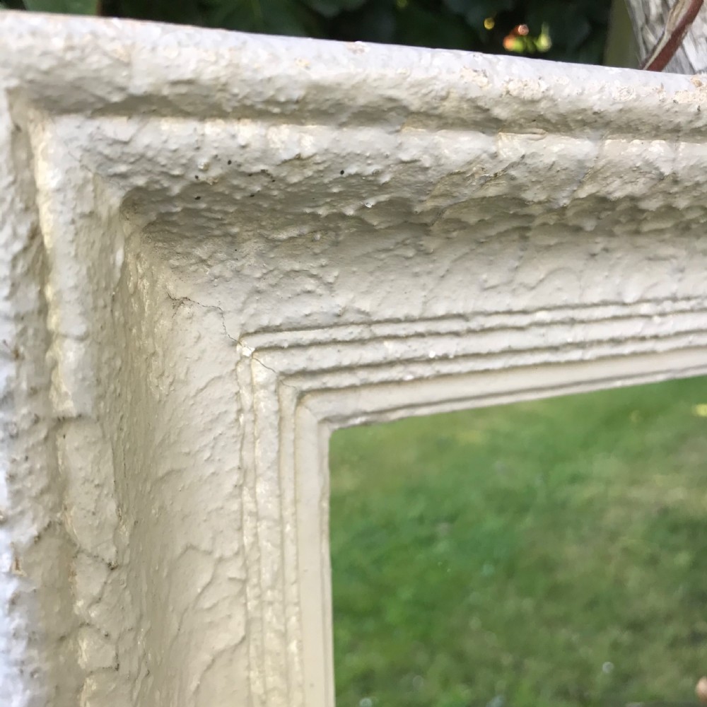 A rectangular off-white painted French framed wall mirror featuring a moulded timber border and reflective glass plate. View IV