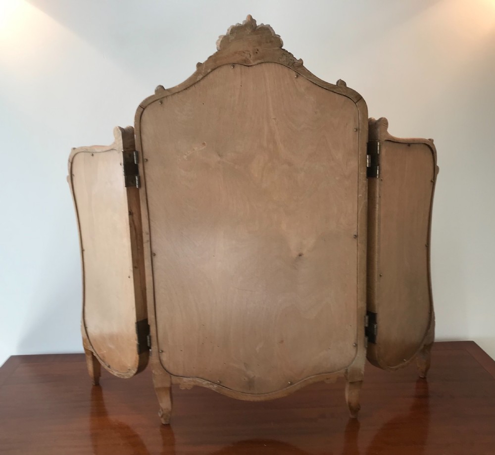 A three-panel French walnut dressing table mirror with carved acanthus leaf crest and cabriole feet. View V