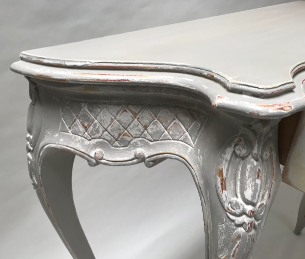 A French Louis XV style grey painted console table featuring cabriole legs, a carved shell motif on the apron, and a serpentine top. View VIII