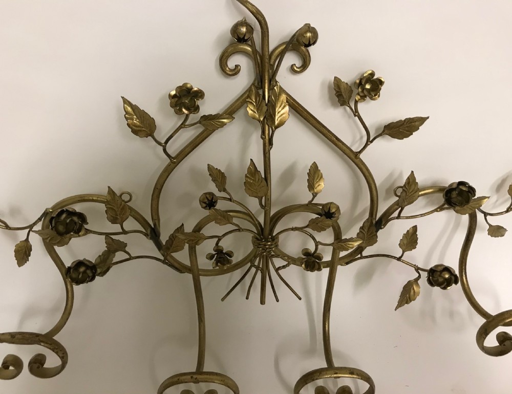 A decorative French gilded metal wall-mounted hook rack featuring elaborate scrollwork, sculpted metal leaves, and flower motifs with four bottom hooks. View II