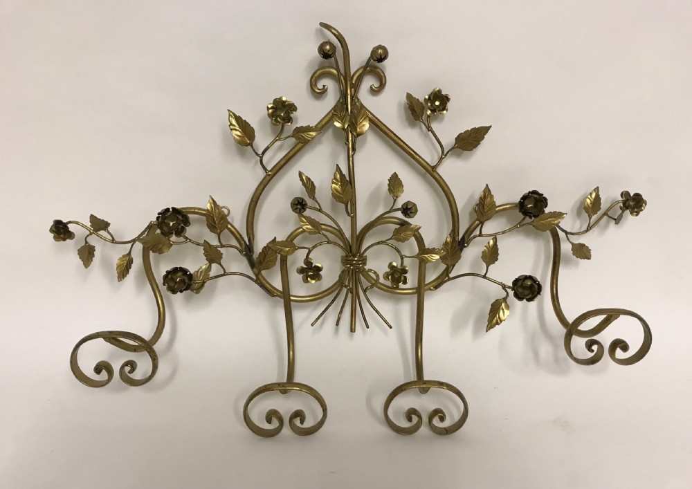 A decorative French gilded metal wall-mounted hook rack featuring elaborate scrollwork, sculpted metal leaves, and flower motifs with four bottom hooks. View IV