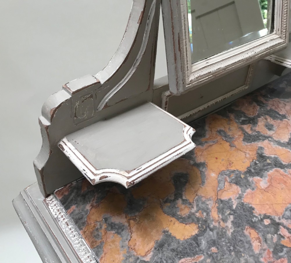 A French painted grey dressing table featuring a variegated reddish-brown marble top, an adjustable central mirror with a carved crest, two small side shelves, and tapered fluted legs. View VIII
