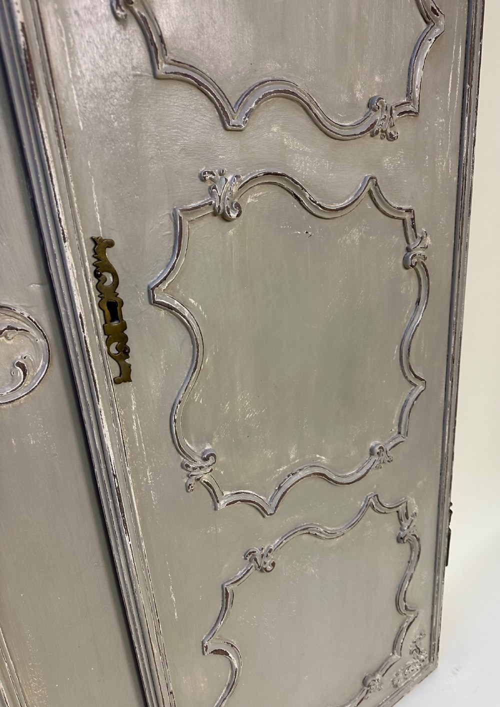A pair of grey painted French timber doors featuring hand-carved Rococo style panel mouldings and metal hardware. View VI