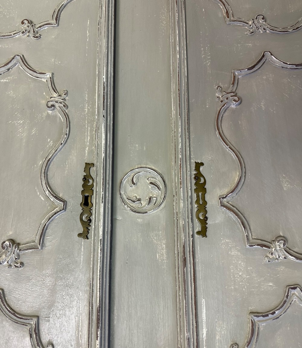 A pair of grey painted French timber doors featuring hand-carved Rococo style panel mouldings and metal hardware. View VII