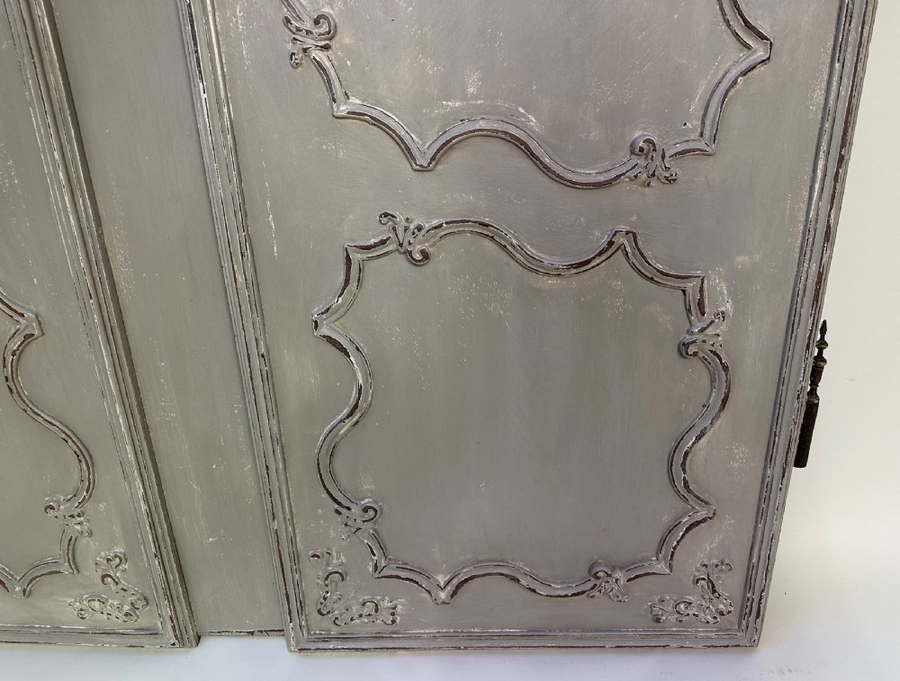 A pair of grey painted French timber doors featuring hand-carved Rococo style panel mouldings and metal hardware. View VIII