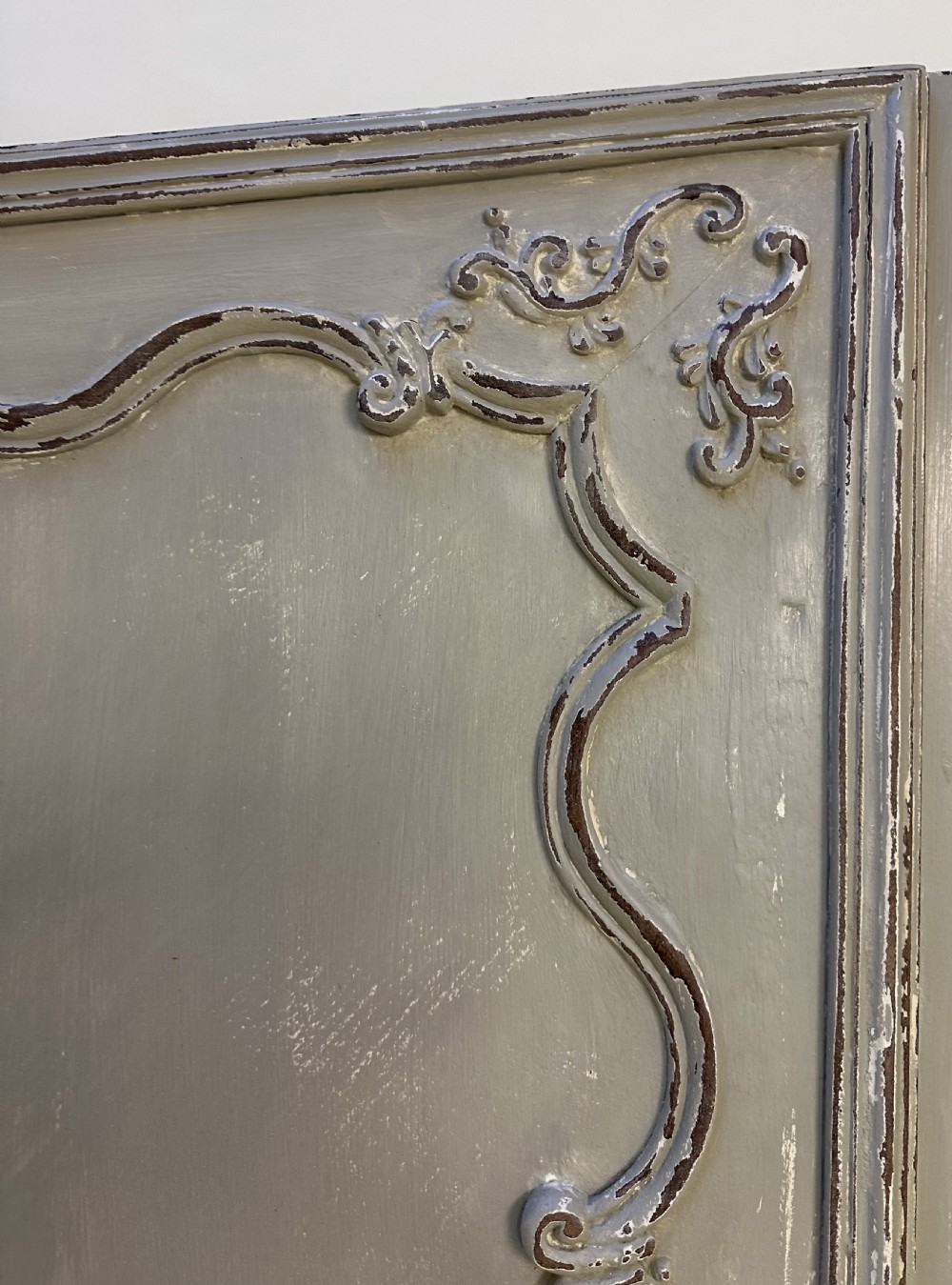 A pair of grey painted French timber doors featuring hand-carved Rococo style panel mouldings and metal hardware. View IX