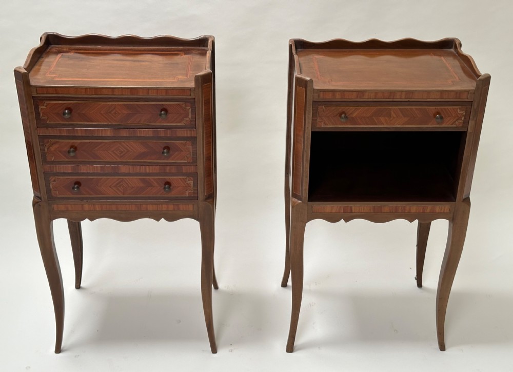 A pair of French Louis XV style warm brown walnut bedside tables featuring geometric parquetry inlay, shaped galleries, and slender cabriole legs. View II