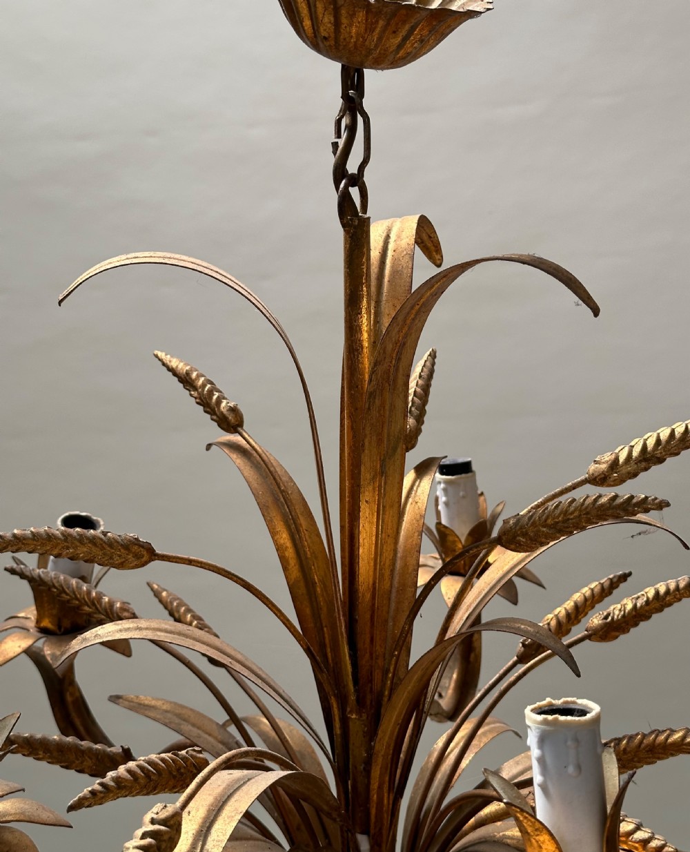 A French gilded metal chandelier crafted in the form of a tied sheaf of wheat with sculpted leaves and five candle bulb sleeves. View II