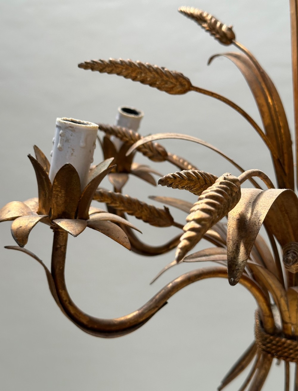 A French gilded metal chandelier crafted in the form of a tied sheaf of wheat with sculpted leaves and five candle bulb sleeves. View III